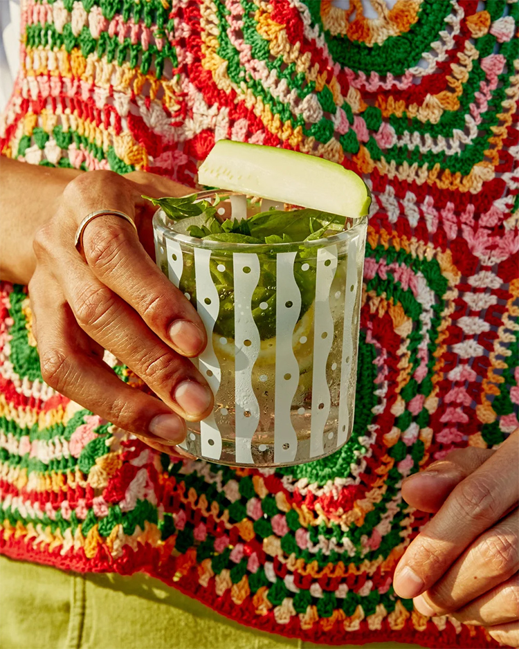 Hand holding a patterned glass