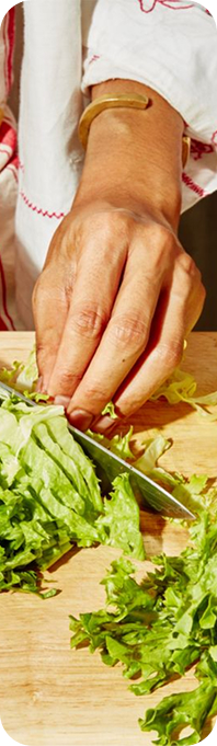 Chef chopping greens